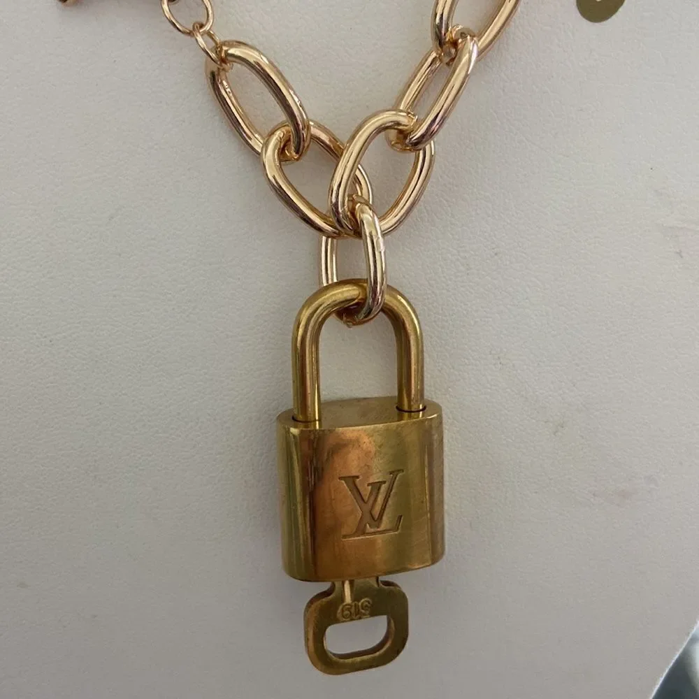 LV key lock with key 100% authentic with NWT necklace